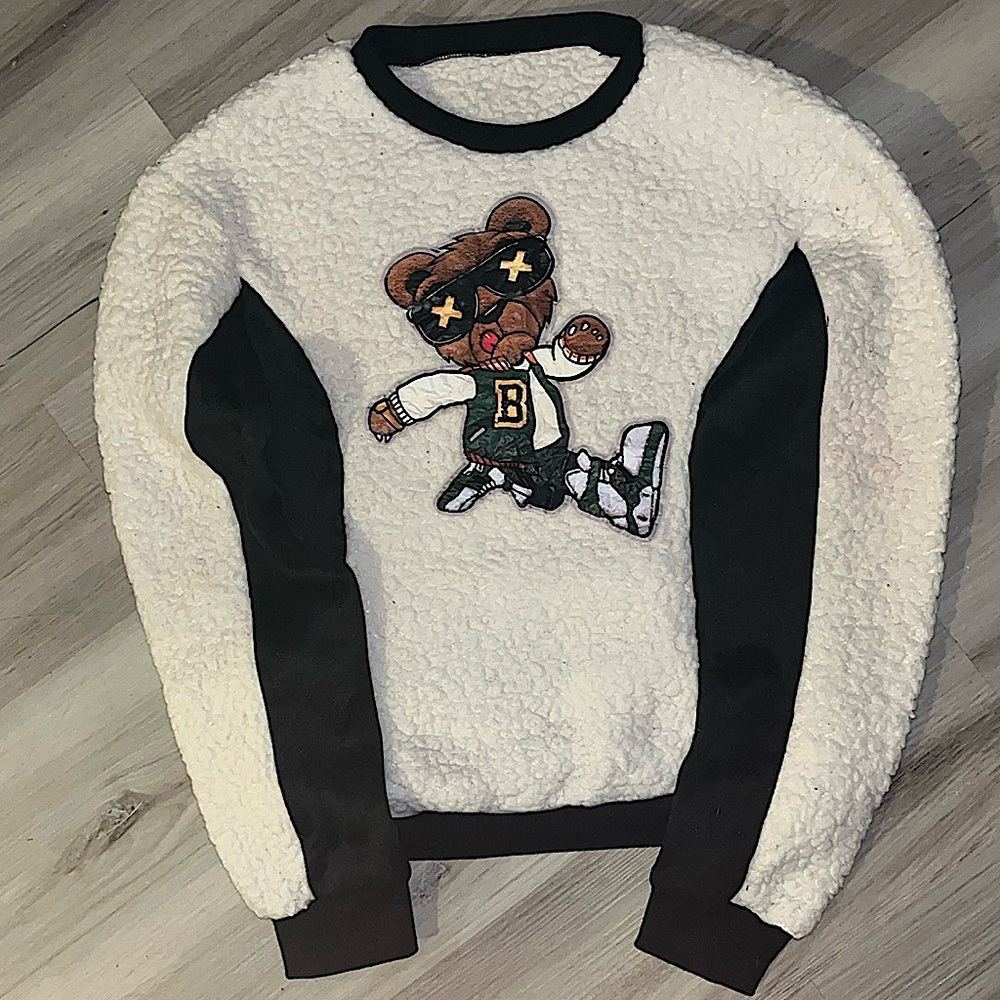 Small, black and white with fur. Off brand and boys shirt.